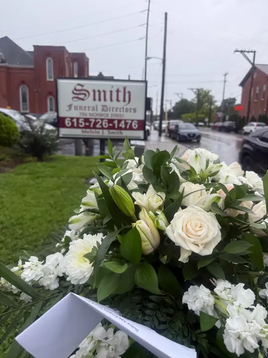 White sympathy bouquet delivered to Smith Funeral Directors